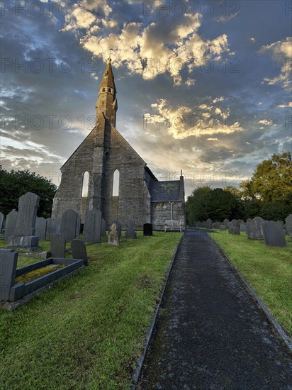 All Saints Church, gravestones in the churchyard, cemetery, evening sky, Llangorwen, Aberystwyth, Ceredigion, Wales, Great Britain