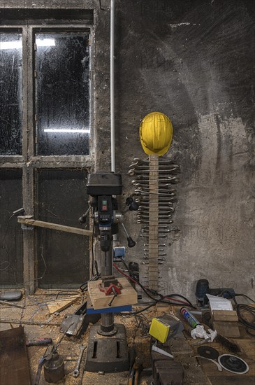 Spanner and construction helmet on the wall of a workshop, Mecklenburg-Vorpommern, Germany, Europe