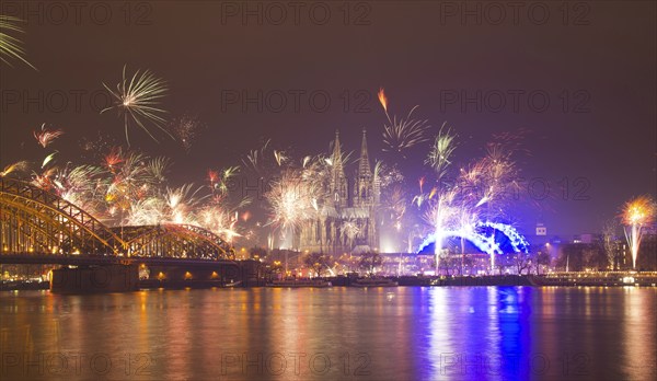 New Year's Eve fireworks, Hohenzollernbruecke with cathedral and Musical Dome, Rheinufer, Cologne, Rhineland, North Rhine-Westphalia, Germany, Europe