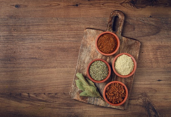 Georgian spices, in ceramic bowls, assortment, set of spices, utsho, adjika, Svan salt, ground coriander, top view, no people