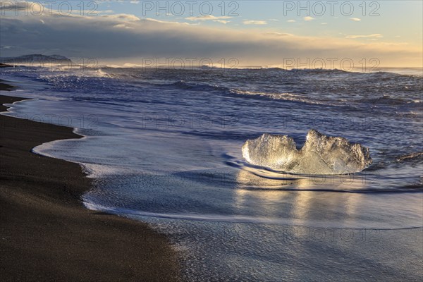 Ice floes on the beach, waves, sunny, morning mood, winter, Diamond Beach, Breidamerkursandur, Jökulsarlon, Iceland, Europe