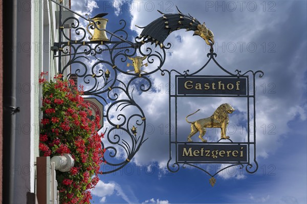 Nose sign of the Goldener Löwe inn and butcher's shop, behind the church of the Assumption of the Virgin Mary, Allersberg, Middle Franconia, Bavaria, Germany, Europe