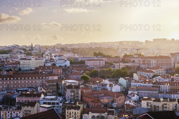 View of Lisbon famous view from Miradouro da Senhora do Monte tourist viewpoint in contre-jou on sunset. Lisbon, Portugal, Europe