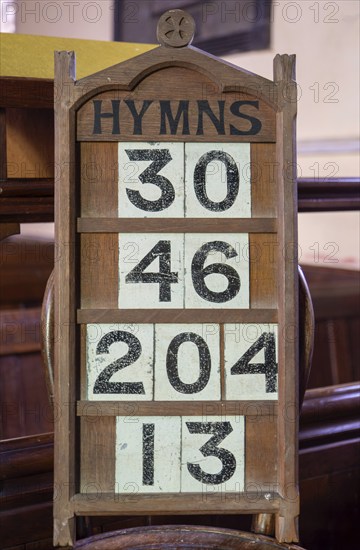 Hymn numbers on display in church, Church of All Saints, Ashbocking, Suffolk, England, UK