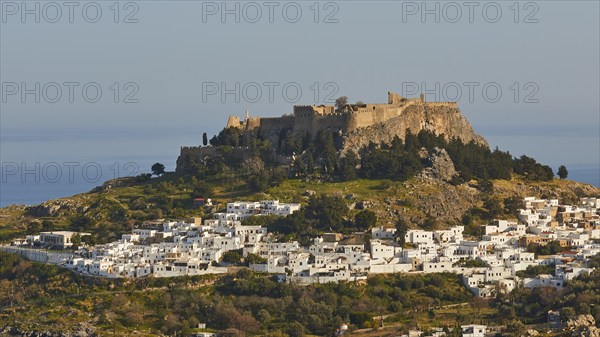 Evening light or late afternoon light, Acropolis and St John's Fortress of Lindos, Lindos village, Rhodes, Dodecanese, Greek Islands, Greece, Europe