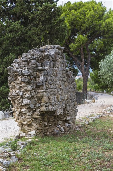 Fragile old stone wall structure at ancient 3rd century Roman ruins of Salona near Solin in late summer, Croatia, Europe