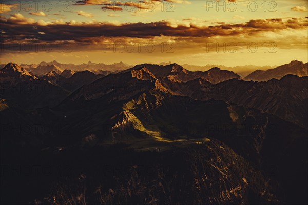 Thaneller summit at sunset in the Lechtal valley in Tyrol with a wonderful view of the surrounding mountains. Tyrol, Austria, Europe