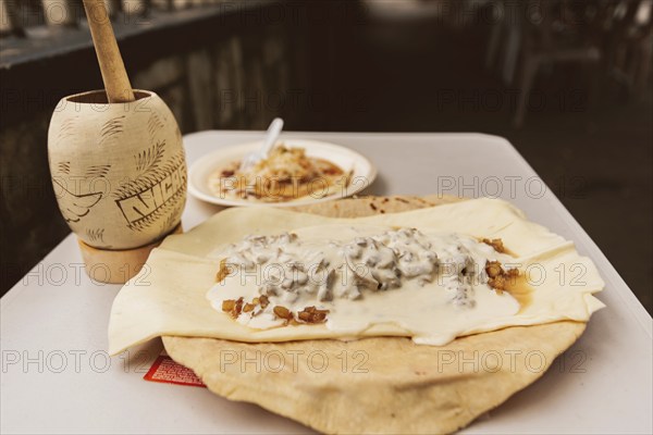 Cacao and traditional Nicaraguan quesillo served on the table