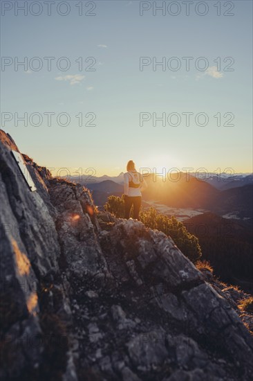 Trail running in autumn on the Jochberg on Lake Walchensee against the wonderful backdrop of the Alps, Bavaria, Germany, Europe