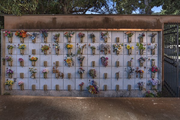 Urn graves with floral decorations at the Monumental Cemetery, in Genoa, Genoa, Italy, Europe