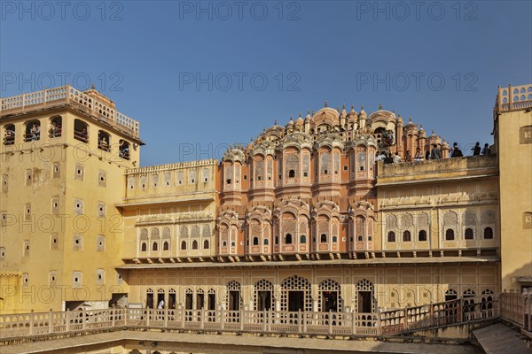 JAIPUR, INDIA, NOVEMBER 18, 2012: Tourists visiting Hawa Mahal palace (Palace of Winds), famous Rajasthan landmark