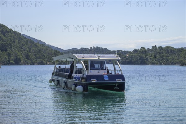 Electric ferry with solar roof sails to Benedictine Abbey, Mljet Island, Dubrovnik-Neretva County, Croatia, Europe