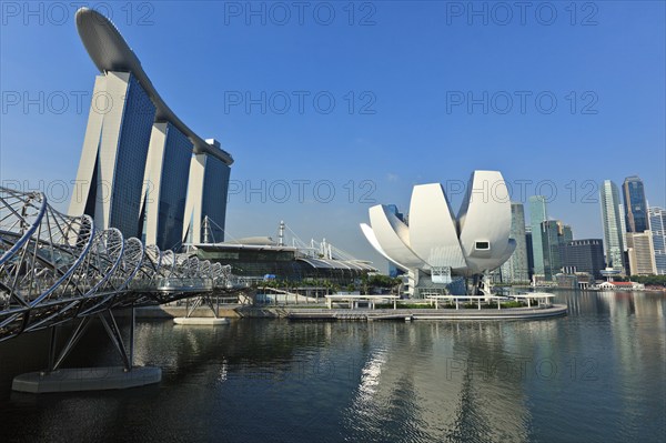 SINGAPORE, MAY 8: The Marina Bay Sands complex and ArtScience Museum on May 8, 2011 in Singapore. Marina Bay Sands is an integrated resort and billed as the world's most expensive standalone casino property