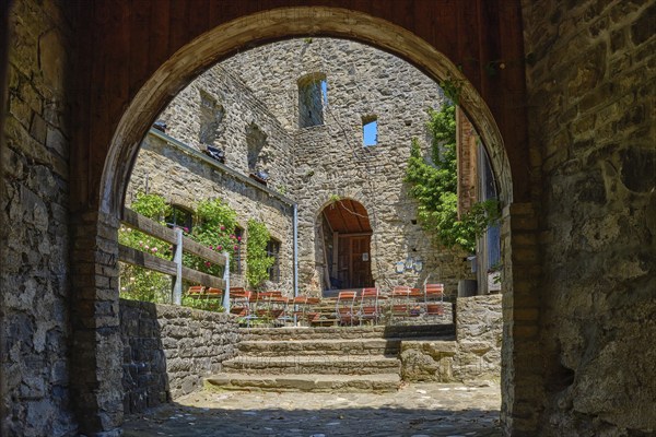 View through the castle gate into the castle courtyard, medieval castle ruins Sulzberg in Allgäu near Kempten, Bavaria, Germany, Europe