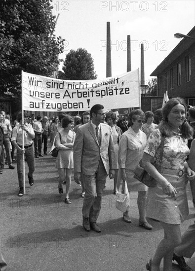 With black flags, mourning and anger, workers of Delog, a factory for flat glass, demonstrated in Gelsenkirchen on 13 July 1971 for the preservation of their jobs