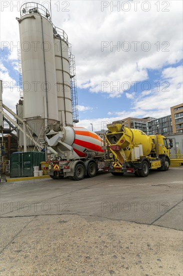 Concrete mixer vehicles in yard, Euromix Concrete, Greenwich, London SE10, England, UK