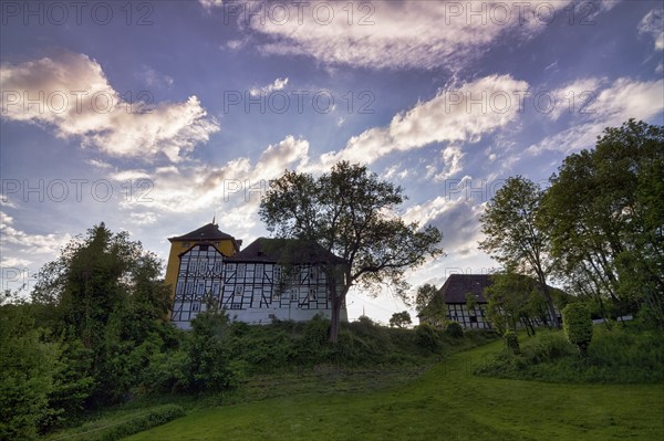 Tonenburg, biker castle, hotel, restaurant and event location, seen from the Weser, backlight, evening sky, Höxter, Weserbergland, North Rhine-Westphalia, Germany, Europe