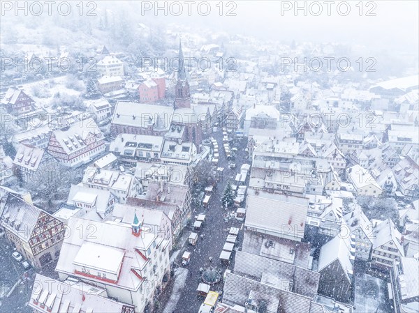 Top view of a wintry town with a church and snow-covered roofs, Black Forest, Calw, Germany, Europe