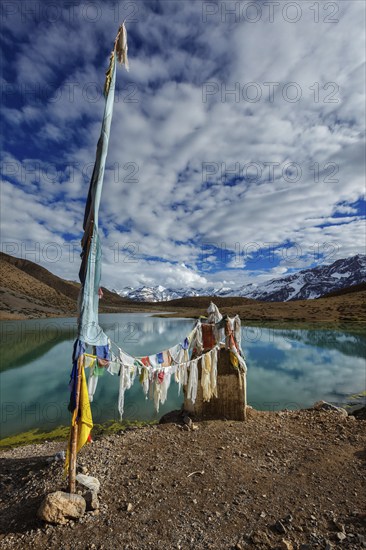 Small gompa with buddhist prayer flags at sacred Dhankar Lake. Spiti Valley, Himachal Pradesh, India, Asia