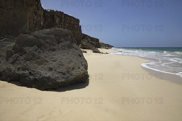 Volcanic rock at Praia de Santa Mónica, sandy beach on the island of Boa Vista, Cape Verde, Cabo Verde archipelago in the Atlantic Ocean, Africa