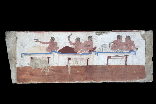 Tomba del Tuffatore, Tomb of the Diver, 480 B. C. Interior painting of the long side with a guest banquet scene with a homosexual pair of lovers and three other people playing the game of Kottabas