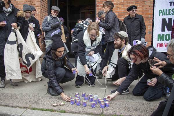 Detroit, Michigan USA, 7 November 2023, Members and supporters of Jewish Voice for Peace held a vigil outside Congressman Shri Thanedar's office, calling for him to support a ceasefire in the war in Gaza. They lit yahrzeit candles in memory of the dead