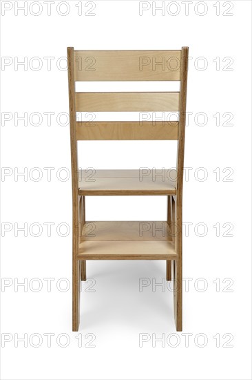 Foldable wooden chair transforming into stepladder on white background