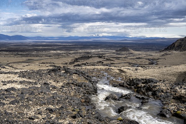 River flows through volcanic landscape, volcanic rocks and tuff, barren landscape, Vatnajökull National Park, Icelandic Highlands, Iceland, Europe