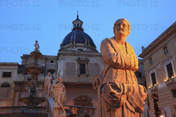 In the old town of Palermo, in Piazza Pretoria, fountain figure of the Fontana Pretoria and the church of Santa Caterina, Sicily, Italy, Europe