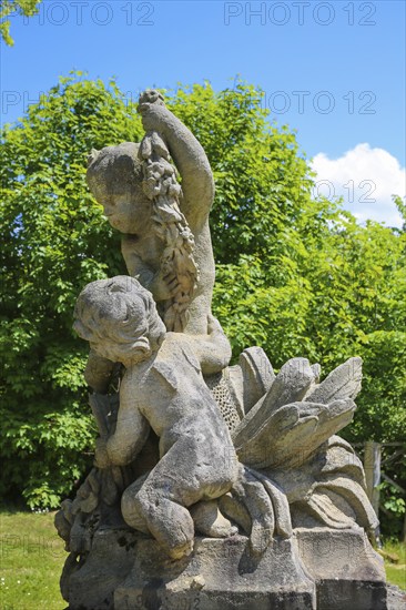 Putti, putti, group of putti in the castle garden, sculpture, stone sculpture, naked child figure, Grafeneck Castle, former hunting lodge of the Dukes of Württemberg around 1560, later summer residence of Duke Carl Eugen von Württemberg, Grafeneck killing centre during the Third Reich, today home for the disabled of the Samaritan Foundation and memorial, documentation centre, historical building, architecture, Gomadingen-Grafeneck, Swabian Alb, Baden-Württemberg, Germany, Europe