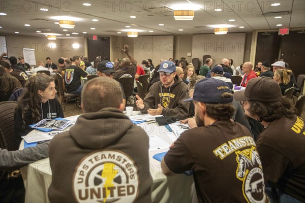 Chicago, Illinois, United Parcel Service workers meet at the annual convention of Teamsters for a Democratic Union. They discussed how to enforce the new union contract they won in July and how to get more members involved in the union