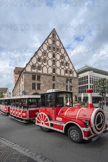 Tourist train passes the medieval toll hall, Nuremberg, Middle Franconia, Bavaria, Germany, Europe