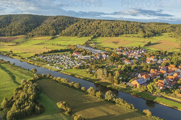 Aerial view of village Oedelsheim and the Weser river at sunset, traditional ferry, Weserbergland, Germany, Europe