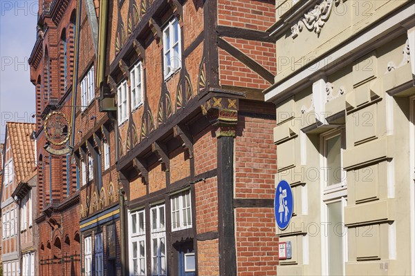 Facades of old half-timbered houses with a nose sign in the historic centre of Stade, Hanseatic city, district of Stade, Lower Saxony, Germany, Europe