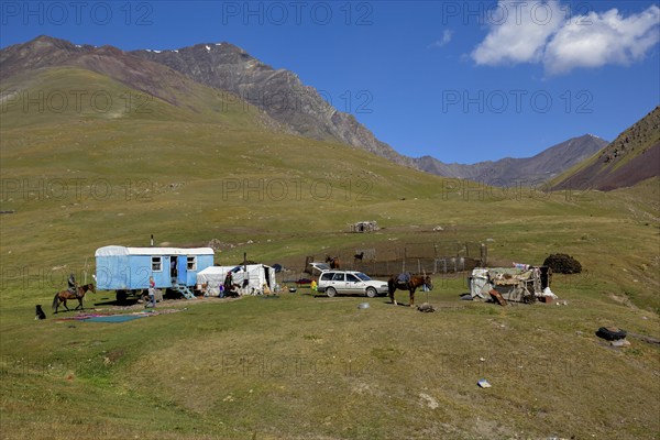 Shepherds with their caravan on their summer pasture, Dshajloo, West Karakol Valley, Tien Shan Mountains, Naryn region, Kyrgyzstan, Asia