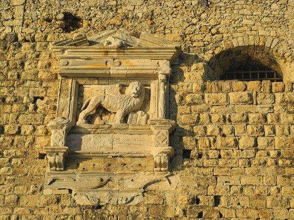 Morning light, Venetian sea fortress, Koules, Morosini, detail, Markus Lion, coat of arms, harbour, Heraklion, capital, island of Crete, Greece, Europe