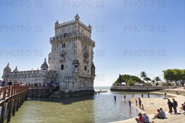 Group of tourists in front of Torre de Belem, landmark, Belém, Lisbon, Portugal, Europe