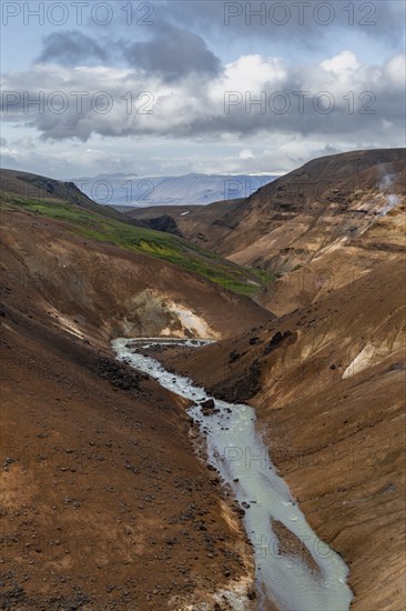 Stream between colourful rhyolite mountains, Hveradalir geothermal area, Kerlingarfjöll, Icelandic highlands, Iceland, Europe