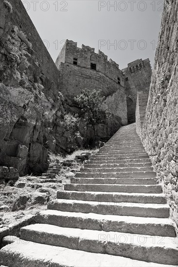 Rhodes Island, Lindos, Lindos is a town on the Greek island of Rhodes. Its landmark is the acropolis on a rock with huge archways from the 4th century and reliefs dating from around 280 BC