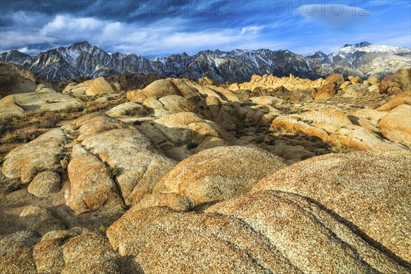 Granite boulder with Sierra Nevada mountain range in background, Lone Pine Peak, 12994, feet, Mt. Whitney, 14497, highest mountain in USA, Lower 48, Alabama Hills, Lone Pine, California, USA, North America