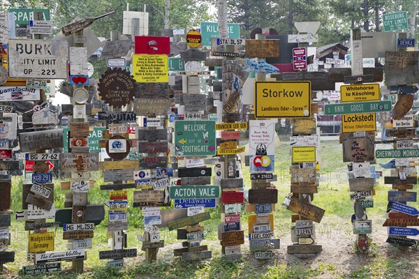 Place and traffic signs in the signpost forest, Watson Lake, Yukon Territory, Alaska Highway, Canada, North America