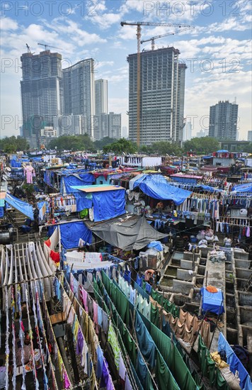 MUMBAI, INDIA, OCTOBER 31, 2019: Dhobi Ghat Mahalaxmi Dhobi Ghat is open air laundromat lavoir in Mumbai, India with laundry drying on ropes. Now signature landmark tourist attractions of Mumbai