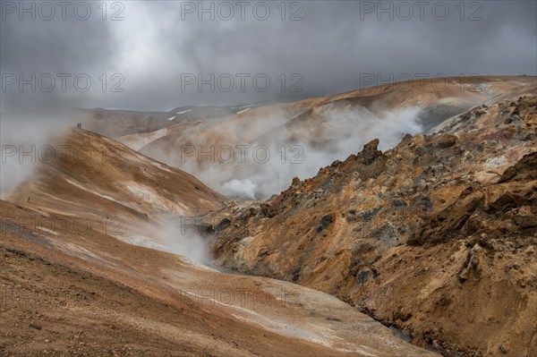 Steaming stream between colourful rhyolite mountains, Hveradalir geothermal area, Kerlingarfjöll, Icelandic highlands, Iceland, Europe