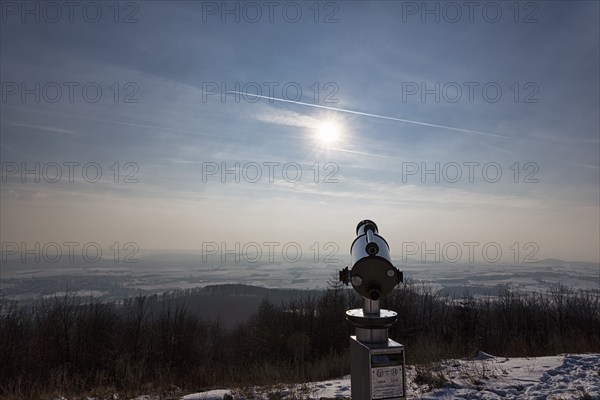 Telescope on a peak pointing towards the sun, sun rays, Köterberg in winter, Lügde, Weserbergland, North Rhine-Westphalia, Germany, Europe