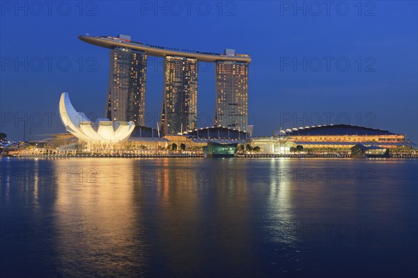 SINGAPORE, MAY 6: The Marina Bay Sands complex on sunset on May 6, 2011 in Singapore. Marina Bay Sands is an integrated resort and billed as the world's most expensive standalone casino property