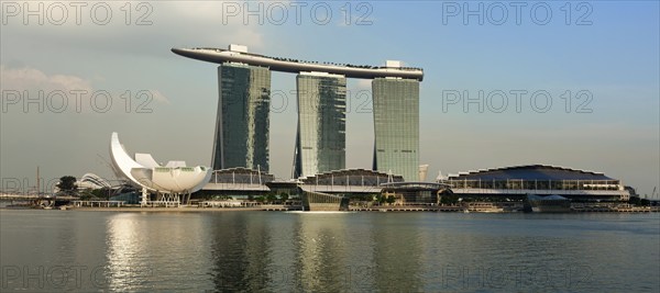 SINGAPORE, MAY 6: The Marina Bay Sands complex on sunset on May 6, 2011 in Singapore. Marina Bay Sands is an integrated resort and billed as the world's most expensive standalone casino property