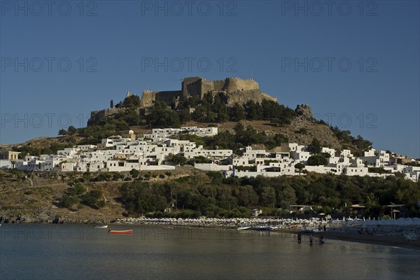 Rhodes Island, Lindos, Lindos is a town on the Greek island of Rhodes. Its landmark is the acropolis on a rock with huge archways from the 4th century and reliefs dating from around 280 BC