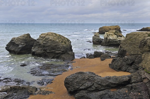 Eroded sea stacks at the Plage des Cinq Pineaux at Saint-Hilaire-de-Riez, La Vendée, Pays de la Loire, France, Europe