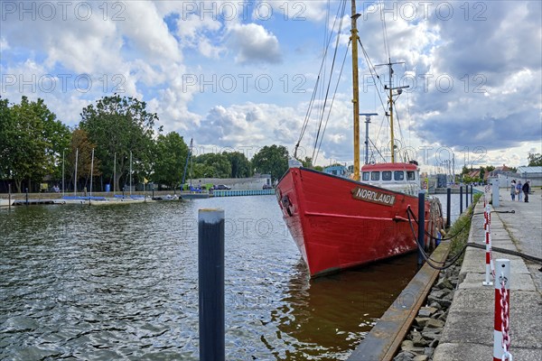 The cutter Nordland III, a former war fishing cutter that was demilitarised after World War II, at its mooring in the city harbour of Greifswald Wieck, Hanseatic City of Greifswald, Mecklenburg-Western Pomerania, Germany, Europe