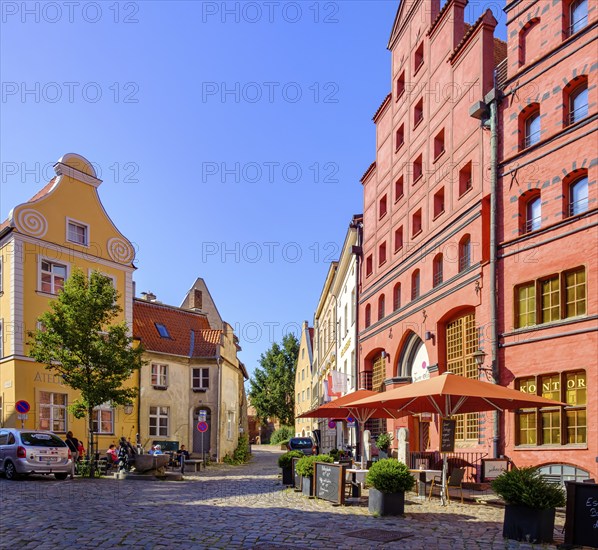 Street scene and historic building fabric with Gothic stepped gables and Baroque volute gables, heritage-protected buildings Fährstraße 24 to 26, UNESCO World Heritage Site, Old Town Hanseatic City of Stralsund, Mecklenburg-Western Pomerania, Germany, condition 4 August 2021, Europe